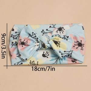 Detail of baby headband featuring floral print on light blue ribbed fabric with dimensions