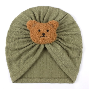 Detailed knit texture and cute plush bear patch on olive green baby turban hat