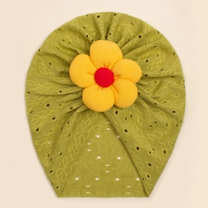 Close-up of olive green baby beanie featuring yellow 3D fabric flower and eyelet embroidery