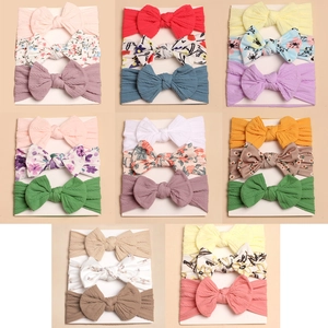 3-piece baby headband set with large cute bows in various colorful prints and textures