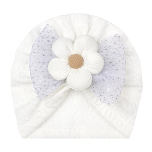 Cute white baby turban hat with large fabric flower and sparkling blue mesh bow