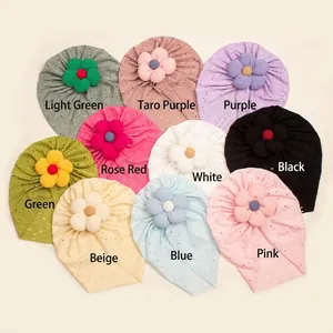 Floral baby turban hats in multiple colors featuring hollow-out patterns and 3D flowers