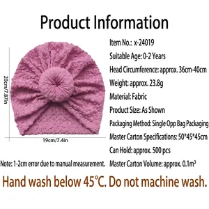 Pink waffle texture baby donut hat with knot detail for infants 0-2 years old
