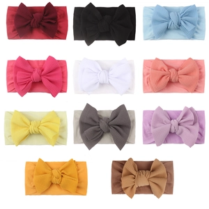 Set di 11 fasce per neonati in nylon colorate con fiocchi in tessuto goffrato