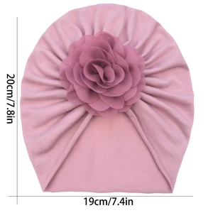 Pink infant turban hat with large 3D fabric flower and detailed size measurements