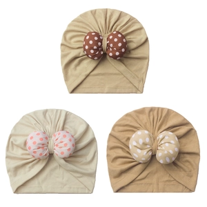 Three-piece baby turban hat set with polka dot bows in khaki, beige, and tan colors