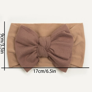 Detailed size view of soft nylon baby headband with bow measuring 17cm by 9cm