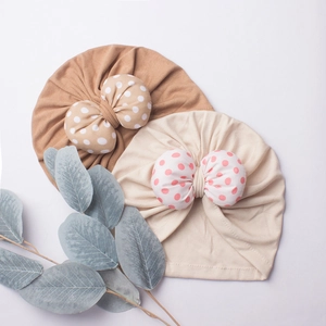Baby turban hats in khaki and beige with large polka dot bows for newborns