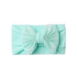Detail of mint green baby headband with soft nylon mesh bow and silver glitter accents