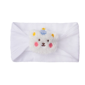 Close-up of white elastic baby headband featuring a soft plush bear with blue striped hat