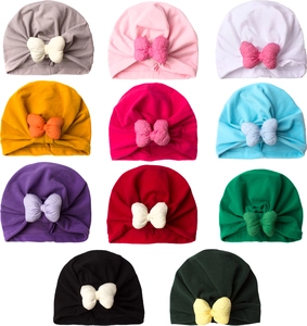 Detail view of 11 multi-color knotted baby hats with 3D bow and soft knit fabric