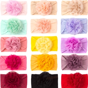 Détail de 15 bandeaux bébé en nylon colorés avec de grandes fleurs en mousseline