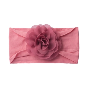 Pink soft knit baby headband featuring a large delicate layered chiffon flower