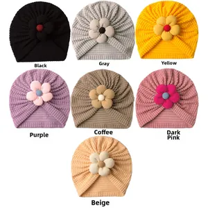 Selection of ribbed baby turbans with decorative fabric flowers in seven assorted colors
