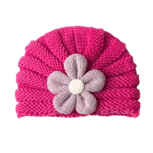 Cozy rose red baby knitted hat with a purple plaid floral decoration on a white background