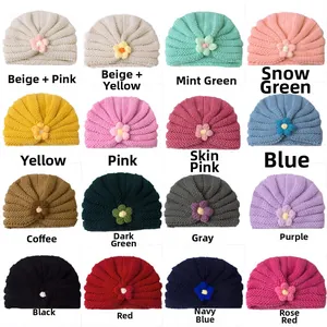 Grid display of baby knitted beanies in 16 colors with handmade floral detail