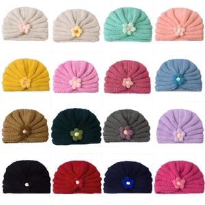 Winter knitted baby turban hats with crochet flowers in sixteen various assorted colors