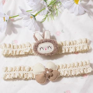 Detail of baby lace headbands with plush rabbit ears and corduroy bow floral accents