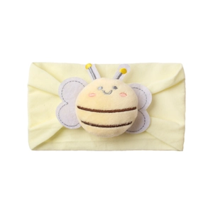 Detailed view of yellow baby headband featuring a plush 3D bee with embroidered wings