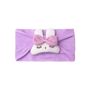Detail of baby headband with purple elastic fabric and white plush rabbit ornament