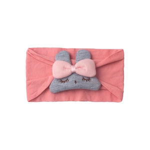 Close-up of pink elastic baby headband with cute gray rabbit bunny embroidery detail