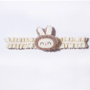 Cream lace baby headband with a cute brown plush bunny head and soft elastic lace band
