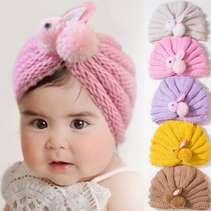 Cute baby knit hat with plush bunny ears and balls for infants available in multiple colors