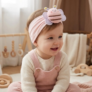 Pink nylon baby headband with plush bee decoration on soft high elastic material