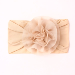 Bandeau bébé en nylon doux avec grande fleur en organza beige et bande extensible