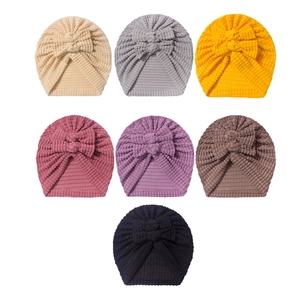 Cozy baby beanie set with cute bow tie in seven solid colors for infant winter warmth