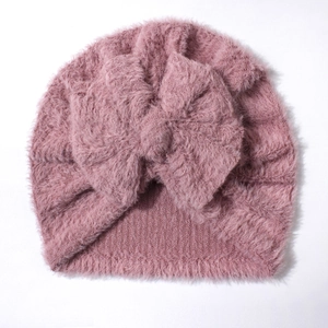 Pink plush baby turban hat with oversized bow decoration for autumn and winter