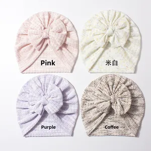 Dettagli di quattro cappelli a turbante per neonati colorati con grandi fiocchi in maglia