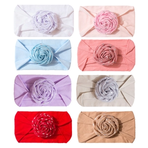 Set of 8 elastic baby headbands with shimmering fabric roses in various soft colors