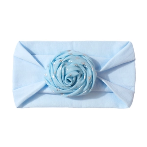 Elastic light blue baby headband with a handmade rose featuring silver star prints