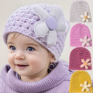 Cozy knit baby beanie with large floral design in various warm colors for winter