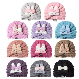 Detailed grid of baby knitted hats featuring cute 3D bunny ears in eleven colors