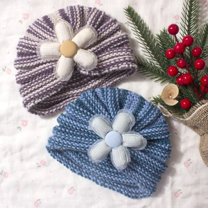 Cute baby knitted beanie hats with colorful stripes and large 3D floral decorations