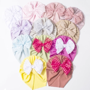 Ribbed knit baby turban hats with sparkling star bows in multiple bright colors