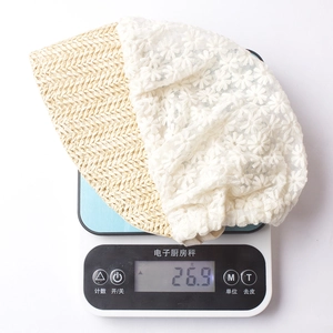 Lightweight baby sun hat weighing only 26.9g featuring lace and straw patchwork details