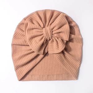 Bonnet bébé en maille gaufrée rose avec un grand nœud 3D pour nouveau-nés
