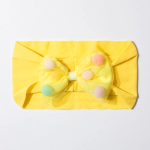 Yellow baby headband with elastic fabric and mesh bow filled with colorful pom-poms