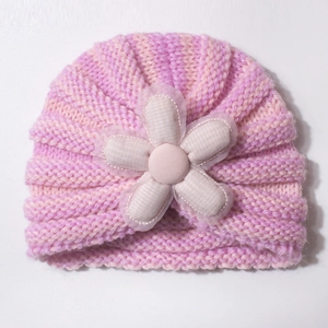 Pink striped knit baby turban hat with a 3D fabric flower and delicate lace petals