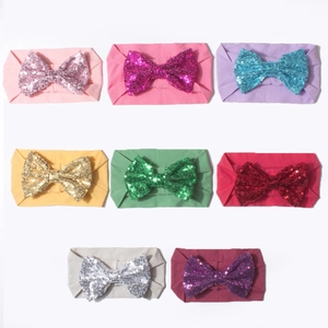 Bandeaux pour bébé colorés avec nœuds en paillettes brillantes sur bandes en nylon