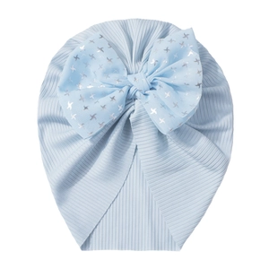 Detailed view of light blue ribbed baby hat with a large silver star foil bow