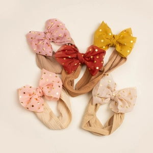 Set of 5 elastic baby headbands with gold foil polka dot mesh bows in warm earth tones