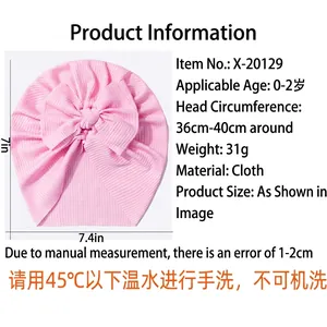 Pink breathable ribbed cotton baby hat with large bow for infants aged 0-2 years