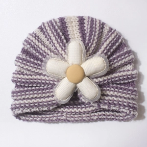 Infant knit turban hat with purple and white stripes and a large white floral accent