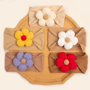 5-piece set of baby ribbed knit headbands with large 3D floral accents in warm earthy tones