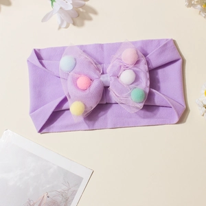Purple baby headband featuring a mesh bow with colorful plush balls on a soft elastic band