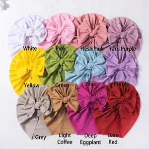 Set of 12 ribbed baby turban hats with large bows in various pastel and vibrant colors